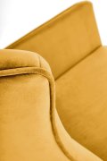 Fotel do salonu, bujany, nowoczesny, musztardowy, na czarnych drewnianych płozach, tkanina velvet
