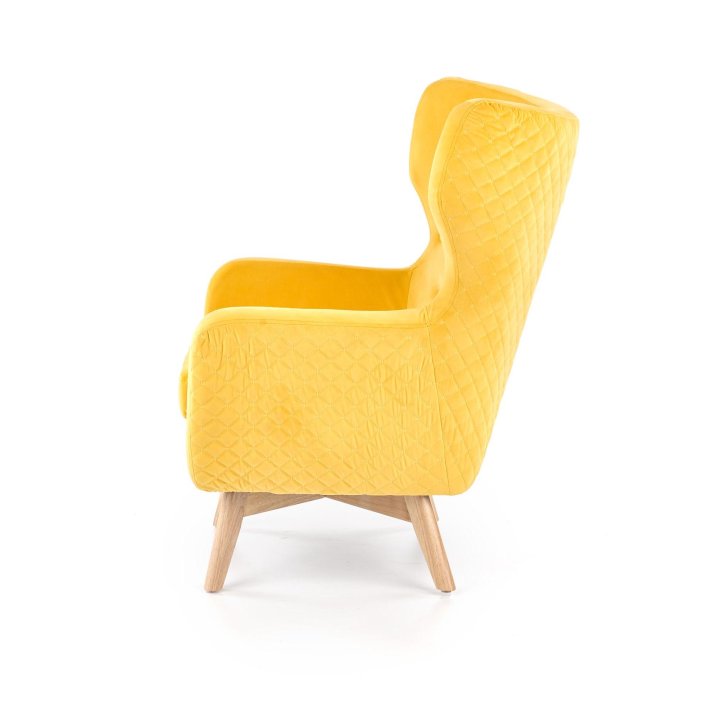 Fotel do salonu, klasyczny, tradycyjny, typu uszak, żółta tapicerka, nóżki drewniane, oparcie pikowane