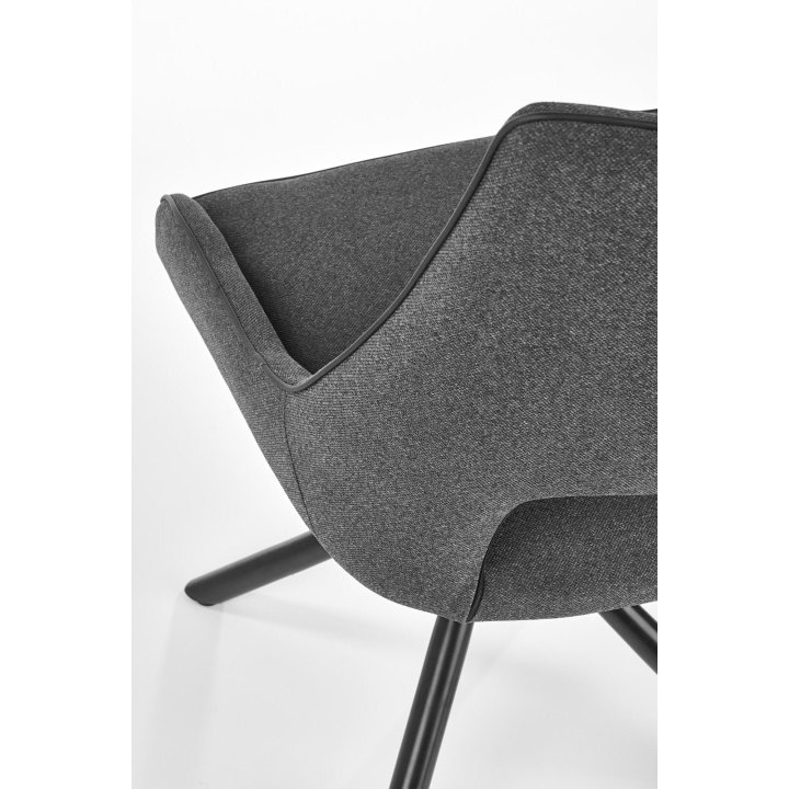 Krzesło do salonu z designerską podstawą i popieltą tapicerką