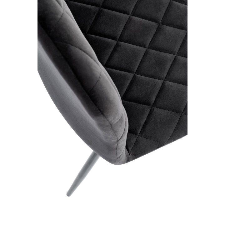 Czarne pikowane krzesło do jadalni z czarnymi nogami