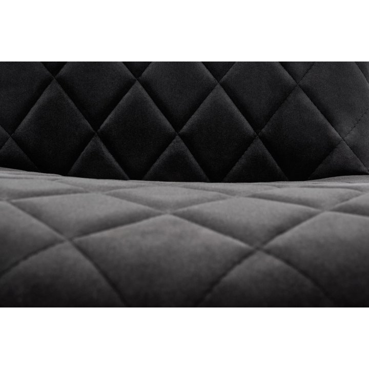 Czarne pikowane krzesło do jadalni z czarnymi nogami