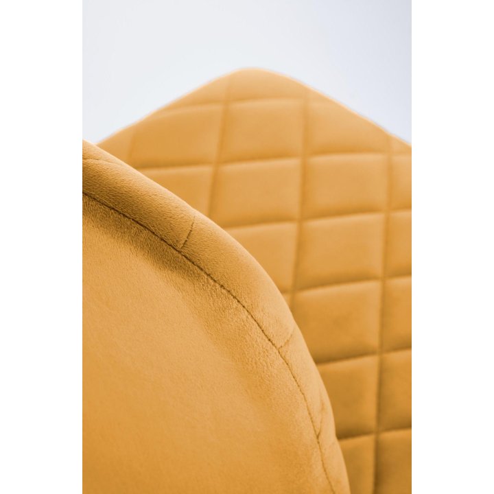 Musztardowe tapicerowane krzesło do jadalni z czarnymi nogami