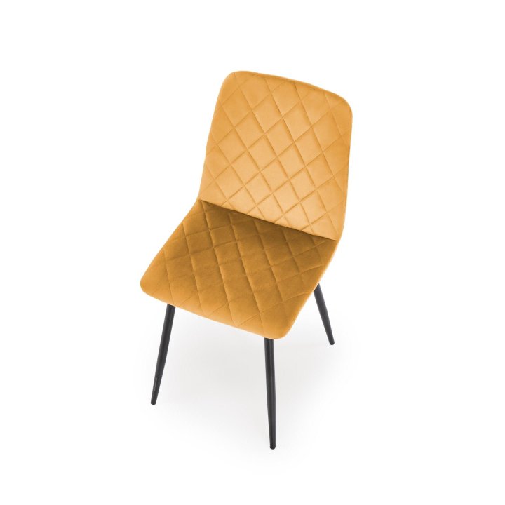 Musztardowe tapicerowane krzesło do jadalni z czarnymi nogami